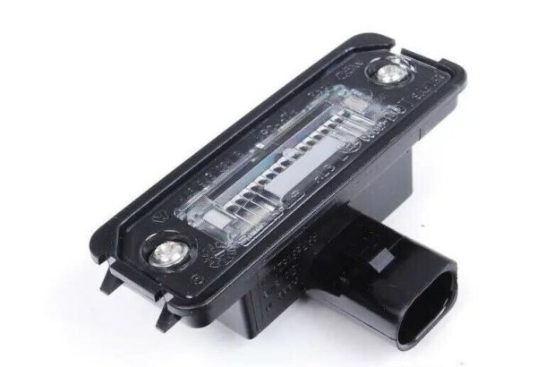 NEW GENUINE PORSCHE CAYENNE 911 BOXSTER CAYMAN REAR LICENSE PLATE LIGHT 99763162002