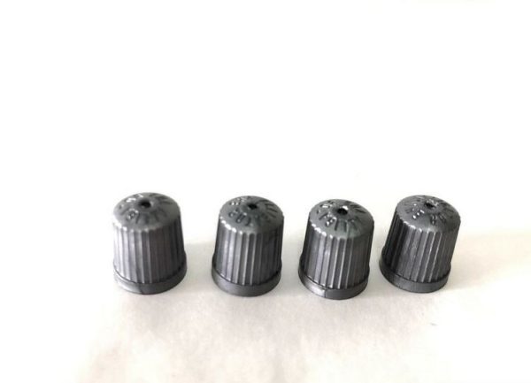 NEW GENUINE MERCEDES BENZ SET OF 4 PLASTIC GREY VALVE CAPS A0004010609