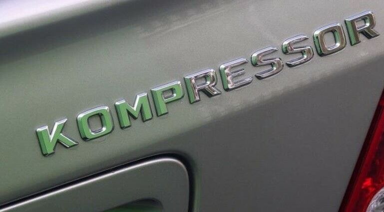 NEW GENUINE MERCEDES BENZ E CLASS REAR TRUNK KOMPRESSOR LETTERING CHROME BADGE A2038173015