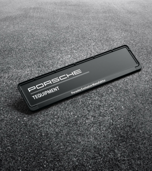 Black plastic genuine license plate frame with Porsche Exclusive Manufaktur logo