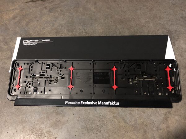 Black plastic genuine license plate frame with Porsche Exclusive Manufaktur logo - Image 2